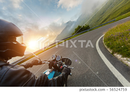 View from motorcycle driver perspective in sunset View from motorcycle driver perspective in sunset 56524759