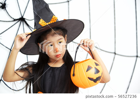 Happy Halloween little witch with a pumpkin 56527236