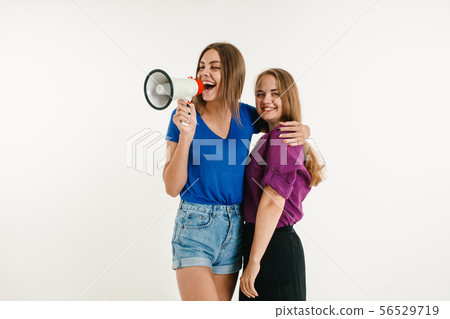 Young women weared in LGBT flag colors isolated on white background, LGBT pride concept 56529719