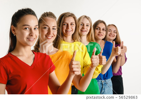 Young women weared in LGBT flag colors isolated on white background, LGBT pride concept 56529863