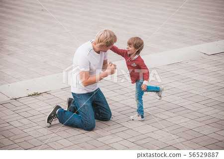 Father playing with his little son 56529887