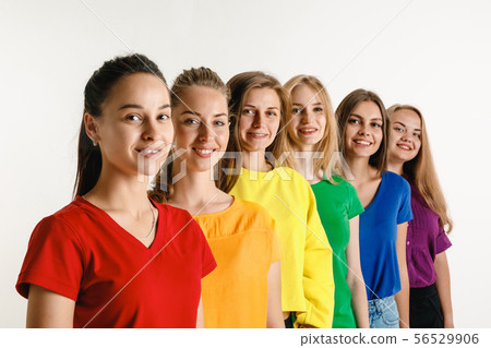 Young women weared in LGBT flag colors isolated on white background, LGBT pride concept 56529906