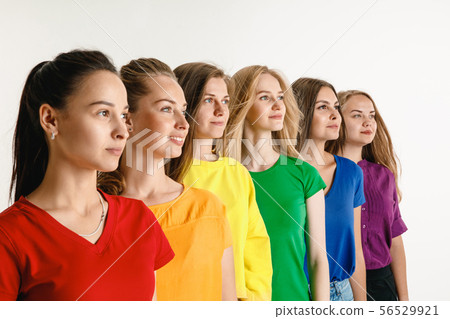 Young women weared in LGBT flag colors isolated on white background, LGBT pride concept 56529921