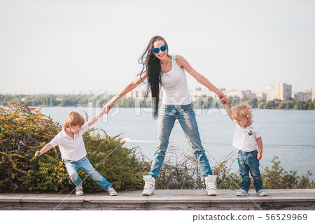 Happy family. Young mother and her five year old son spending time outdoor on a summer day 56529969
