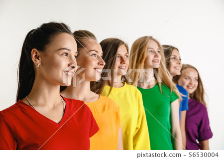 Young women weared in LGBT flag colors isolated on white background, LGBT pride concept 56530004
