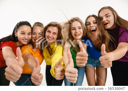 Young women weared in LGBT flag colors isolated on white background, LGBT pride concept Young women weared in LGBT flag colors isolated on white background, LGBT pride concept 56530047