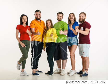 Young people weared in LGBT flag colors isolated on white background, LGBT pride concept Young people weared in LGBT flag colors isolated on white background, LGBT pride concept 56531707