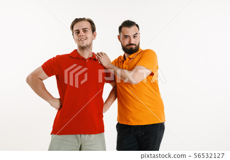 Young men weared in LGBT flag colors isolated on white background, LGBT pride concept 56532127