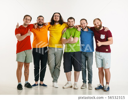 Young men weared in LGBT flag colors isolated on white background, LGBT pride concept Young men weared in LGBT flag colors isolated on white background, LGBT pride concept 56532315