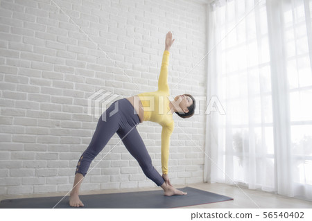 Asian woman doing yoga at home or studio 56540402