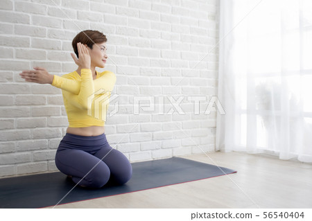 Asian woman doing yoga at home or studio 56540404