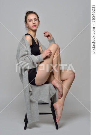 Girl Sitting on Giant Chair Stock Image - Image of barefeet