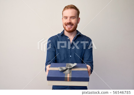 Young man giving present 56546785