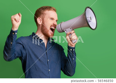 Propagandist shouting in loudspeake 56546850