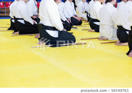 People in kimono on martial arts weapon training seminar 56549761