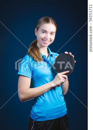 Portrait Of Young woman Playing Tennis On Black 56551711