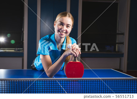beautiful young woman holding a white ball on the beautiful young woman holding a white ball on the 56551713
