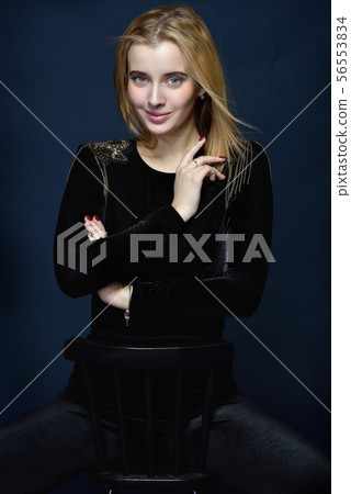 beautiful blonde woman in black velvet dress with beautiful blonde woman in black velvet dress with 56553834