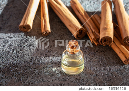 A bottle of essential oil with Ceylon cinnamon 56556326