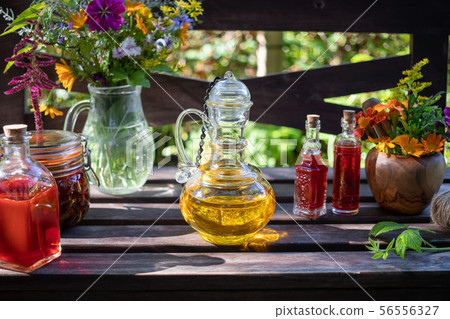 Bottles of borage and St. John's wort oil with 56556327