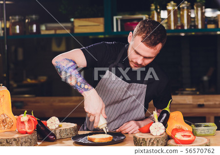 Chef making healthy vegetarian salmon burgers outdoor on open kitchen, odprta kuhna, international Chef making healthy vegetarian salmon burgers outdoor on open kitchen, odprta kuhna, international 56570762