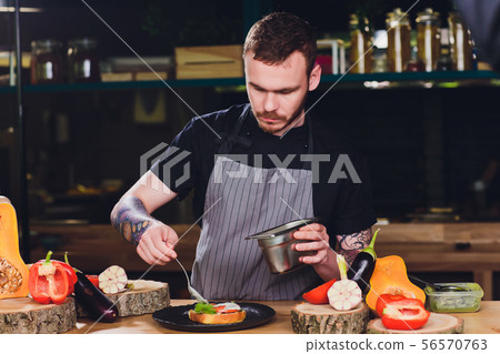 Chef making healthy vegetarian salmon burgers outdoor on open kitchen, odprta kuhna, international Chef making healthy vegetarian salmon burgers outdoor on open kitchen, odprta kuhna, international 56570763