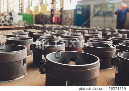 Steel tubes against industrial blurred background. metal 56571339