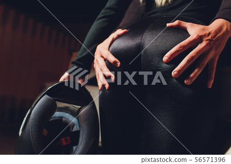 Young girl in leather jacket and leggings sitting on motorcycle, seductive slim biker girl with Young girl in leather jacket and leggings sitting on motorcycle, seductive slim biker girl with 56571396
