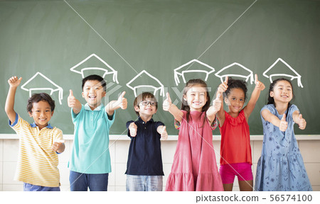 Multi-ethnic group of school children standing in Multi-ethnic group of school children standing in 56574100