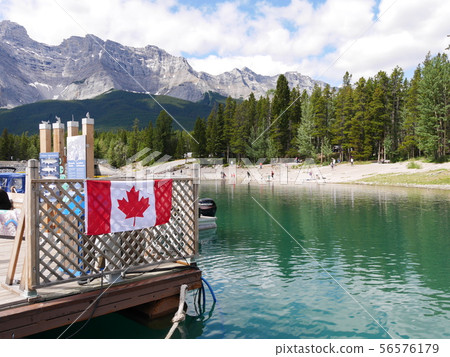 Lake Minnewanka and Canadian flag Lake Minnewanka and Canadian flag 56576179