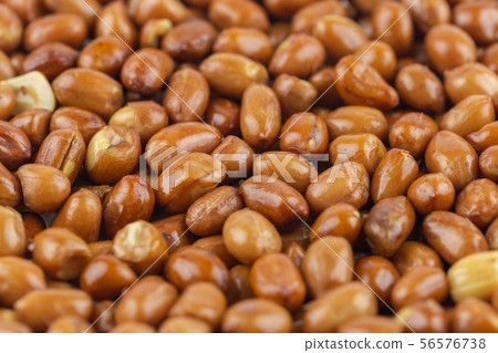 close-up peanut pile texture background. close-up peanut pile texture background. 56576738