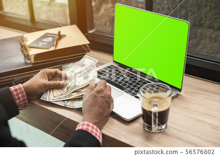 Asian businessman working in in coffee shop cafe 56576802