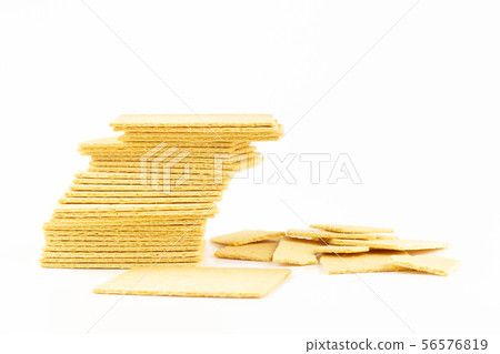 stacked crackers biscuit on white background. 56576819