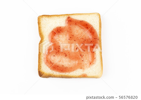 Slice of bread with strawberry jam on white 56576820