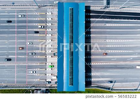 Toll roads on the broad highway. Through the point passes a large number of trucks and cars. Top Toll roads on the broad highway. Through the point passes a large number of trucks and cars. Top 56583222