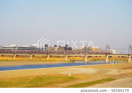 Keio Line passing the Tama River Bridge in the evening 56584179
