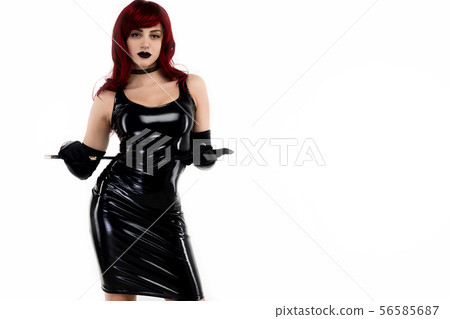 Red-haired passionate lady in a black latex dress 56585687