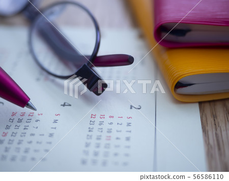Business image · notebook · calendar · glasses · female 56586110