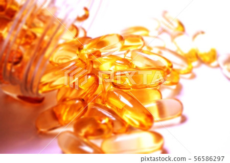 Fish oil supplement capsules on white - image Fish oil supplement capsules on white - image 56586297