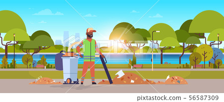 street janitor using industrial vacuum cleaner african american man in uniform vacuuming garbage in street janitor using industrial vacuum cleaner african american man in uniform vacuuming garbage in 56587309