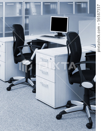 desks and chairs in modern office 56587557