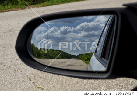 Side rear-view mirror in the morning on the road 56588437