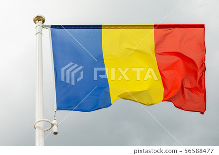 flag of Romania on a flagstuff in front of the sky 56588477