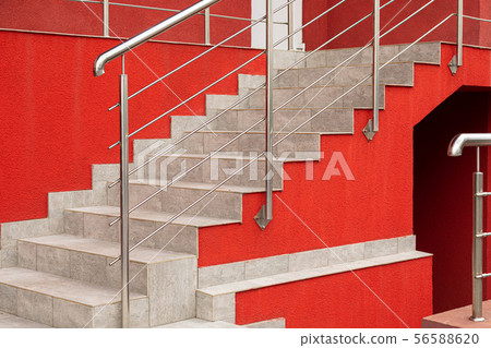 Paved steps on street against fiesta wall 56588620