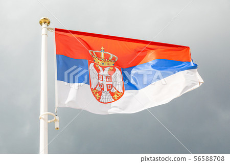 flag of Serbia on a flagstuff in front of the sky flag of Serbia on a flagstuff in front of the sky 56588708