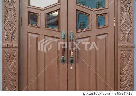 Close-up of wooden door with carving Close-up of wooden door with carving 56588715