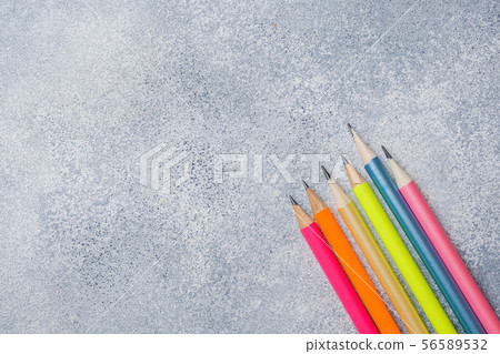 Bright colored pencils on the grey table. concept Bright colored pencils on the grey table. concept 56589532