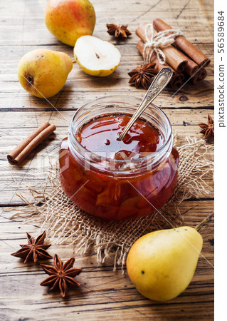 Homemade pear jam in a jar and fresh pears  56589684