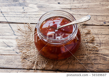 Homemade pear jam in a jar and fresh pears  56589687