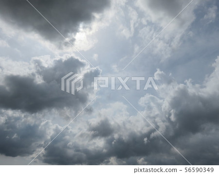 Clouds covering the sun 56590349